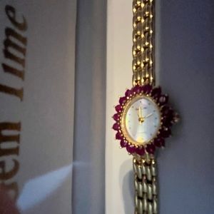 Gem Time Watch with Ruby Colored Crystal Bezel for ladies.